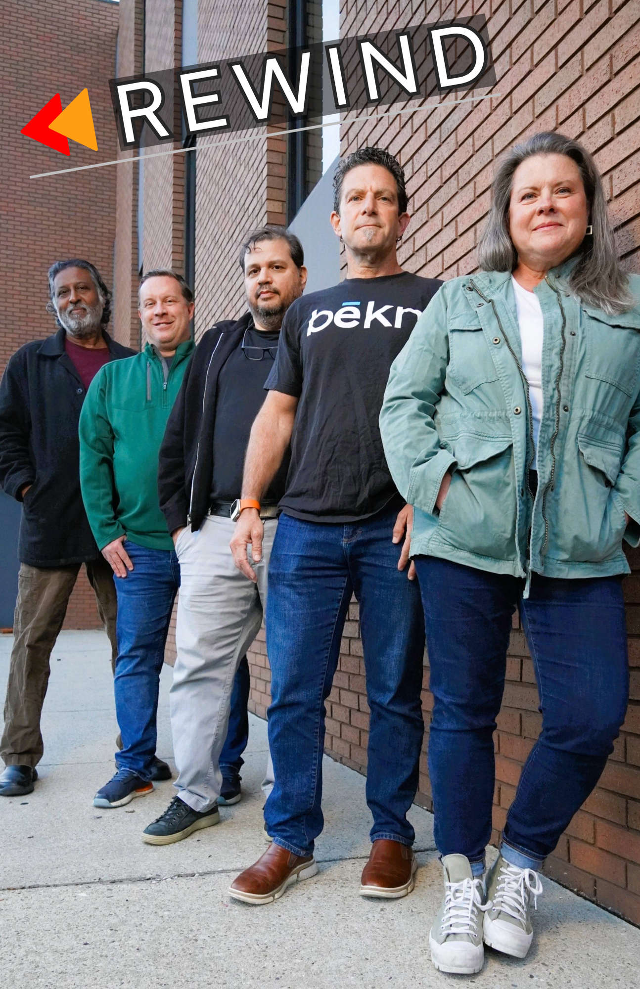 A band posing with the word "Rewind" across the top.