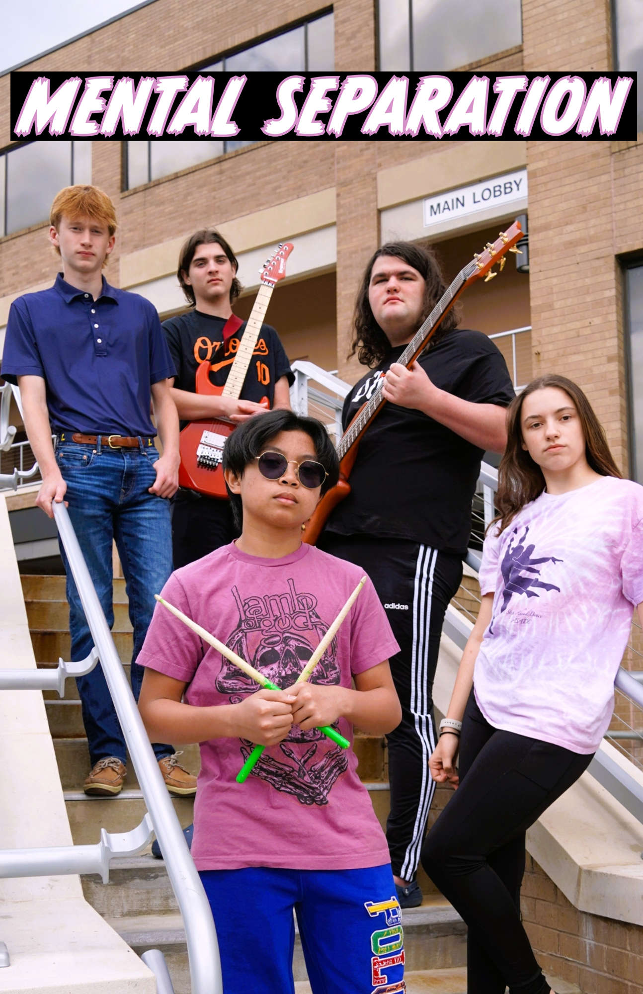 A band posing on stairs with their instruments with the words "Mental Separation" above them.