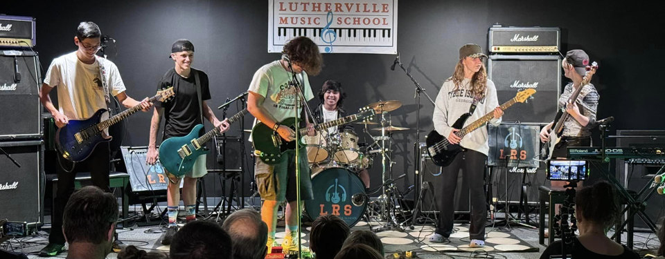 A student band performing on the Lutherville Music School stage.