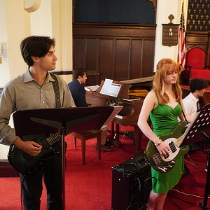 A band of students playing in a church.