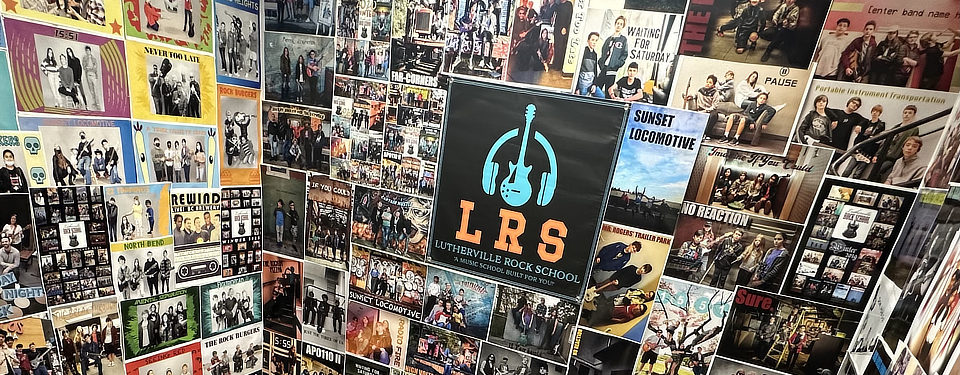 A photo of many band posters surrounding the logo of Lutherville Rock School.