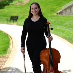 Ella Raley holding a cello.