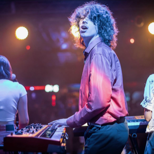 A picture of Luka Vodopic performing on stage.