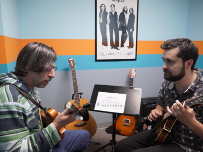 Mandolin and Banjo A photo of a student learning mandolin with teacher Connor Murray.